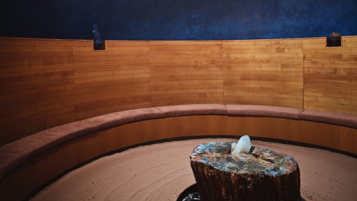 The Crystal Grotto at the Enchantment Resort’s Mii Amo spa has a sandy floor and a crystal platform in the center, as well as four different crystals marking the four compass points, situated around the circular room.