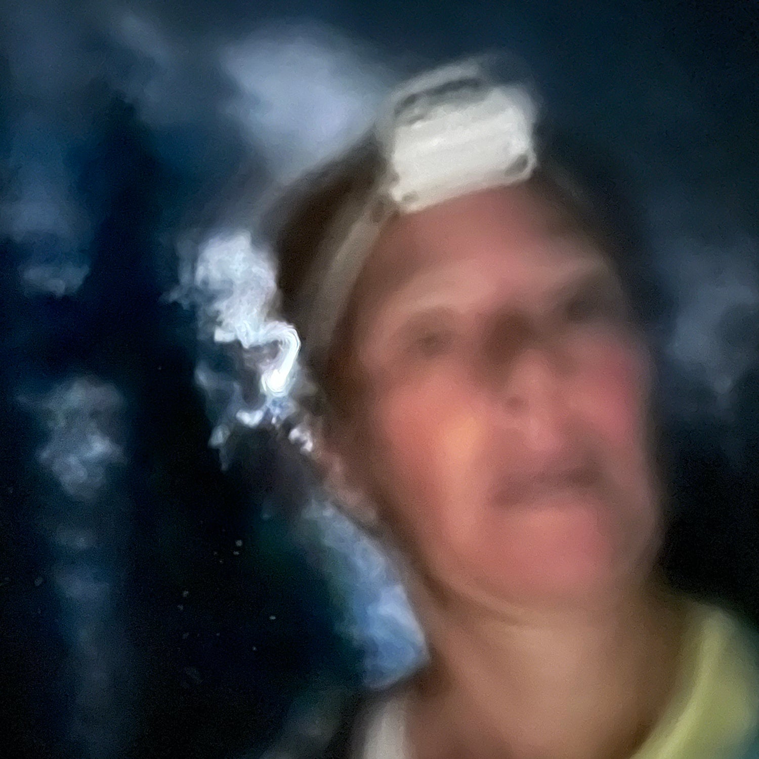 blurry runner in the dark wearing headlamp