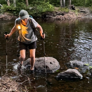 Linda crossing a river