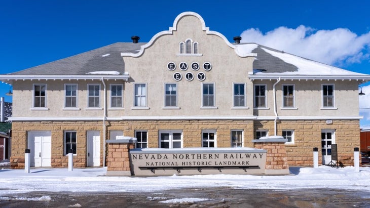 The East Ely depot of the Nevada Northern Railway, a National Historic Landmark. The building and road in front of it are covered in snow.