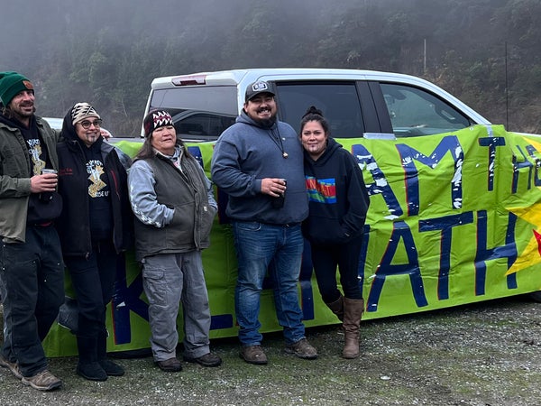 Chook-Chook Hillman, Annelia Hillman, Hoopa elder Dania Rose Colegrove, and Frankie and Molli Myers celebrate the dam removal by the Klamath River.