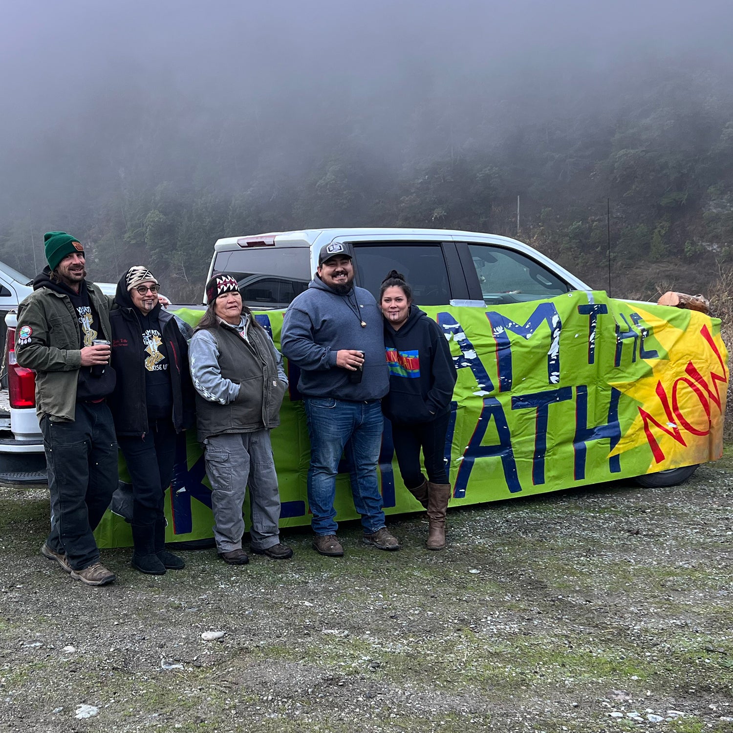 Chook-Chook Hillman, Annelia Hillman, Hoopa elder Dania Rose Colegrove, and Frankie and Molli Myers celebrate the dam removal by the Klamath River.