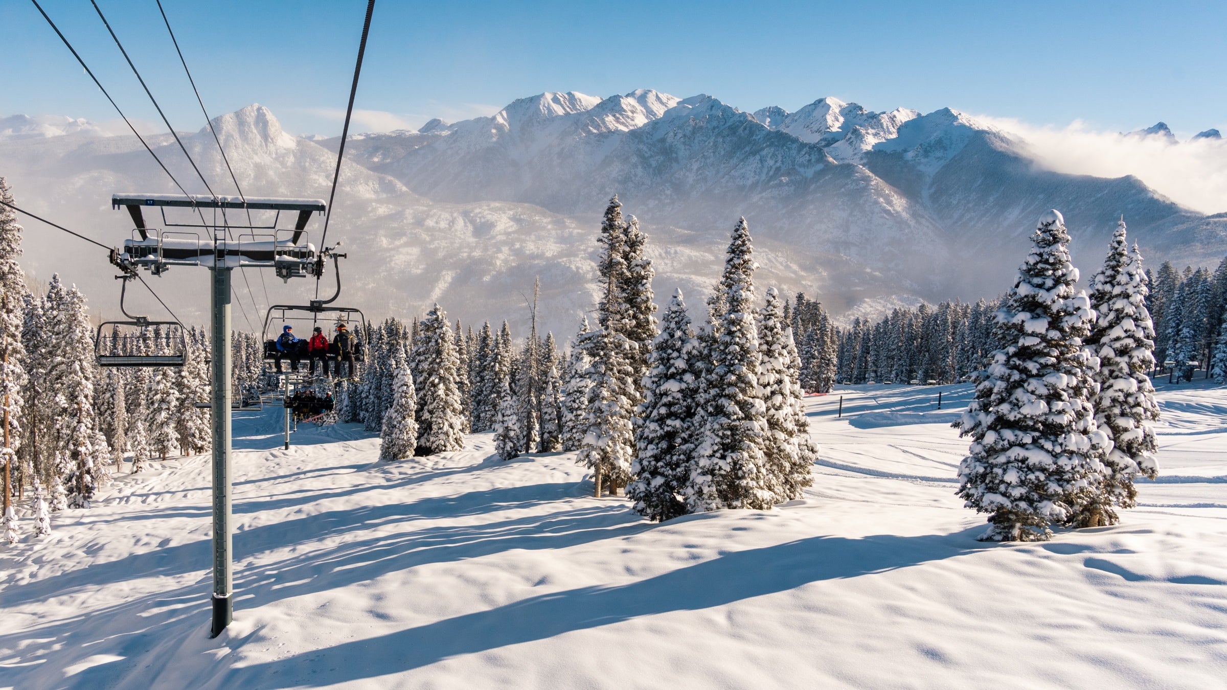 Skiers ride the lift up to the top of Purgatory Ski Resort, in Colorado