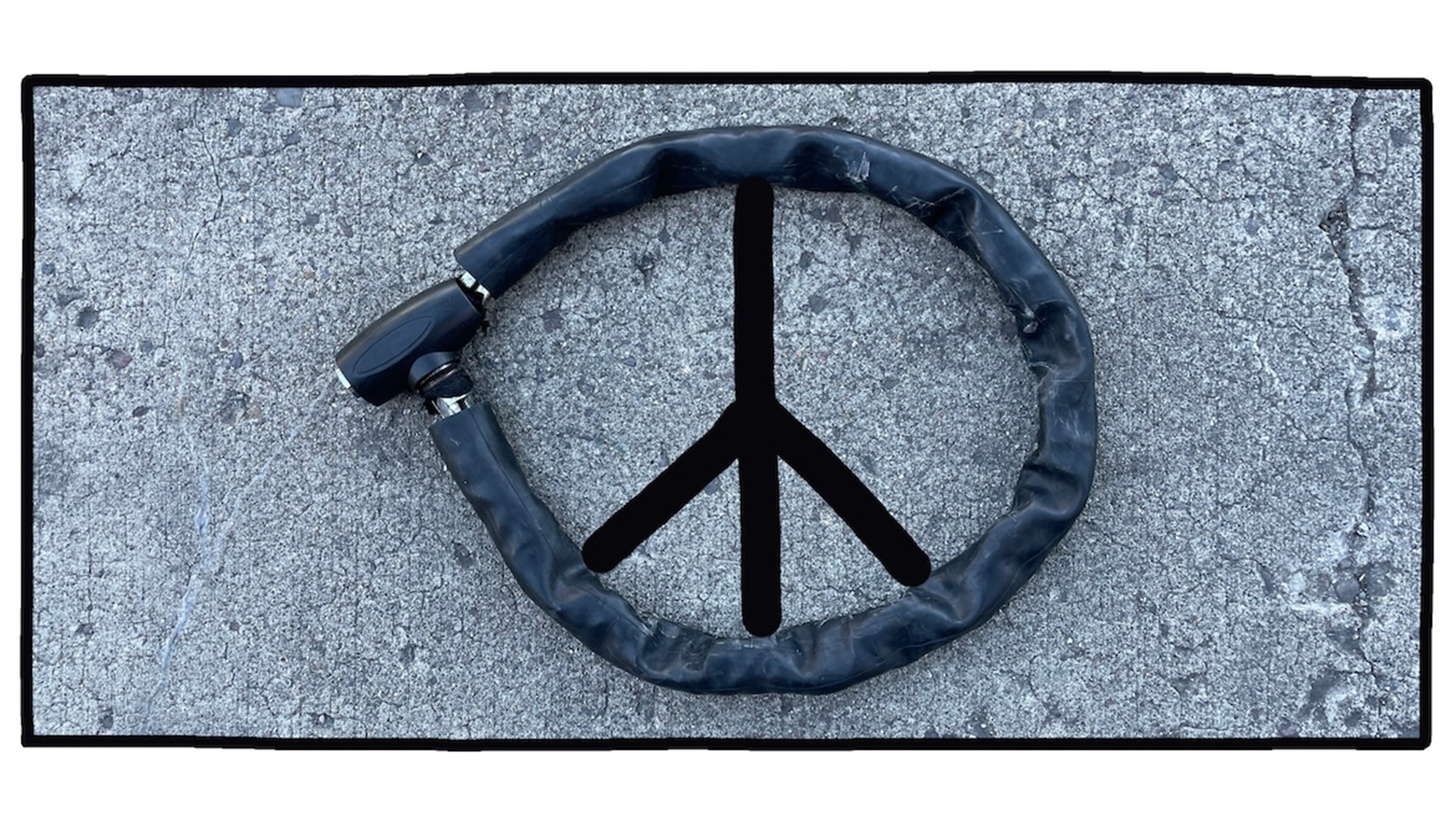 PHOTO OF ROUND BIKE LOCK FORMING PEACE SIGN