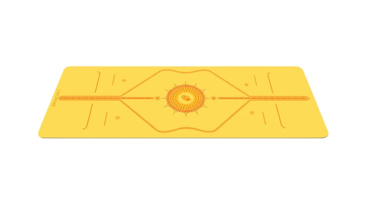 yellow yoga mat with orange design