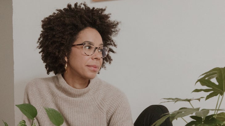 portrait of Ayana Elizabeth Johnson in beige sweater looking sideways