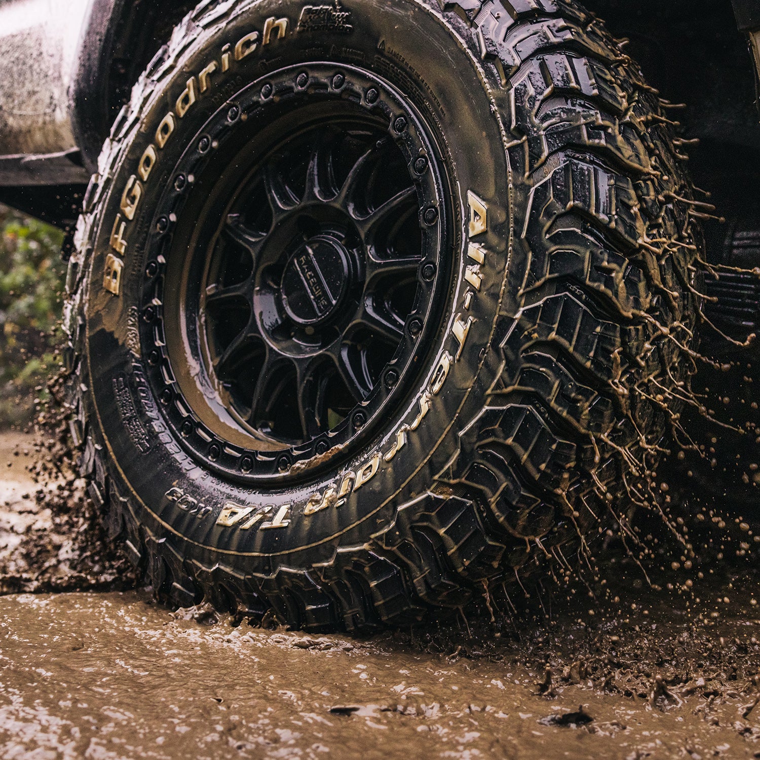 BFGoodrich KO3 all-terrain tire splashing through mud