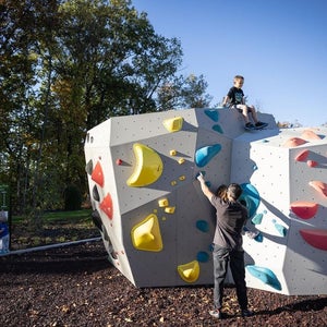 A man climbing in Boyce Bouldering Park, in Allegheny County