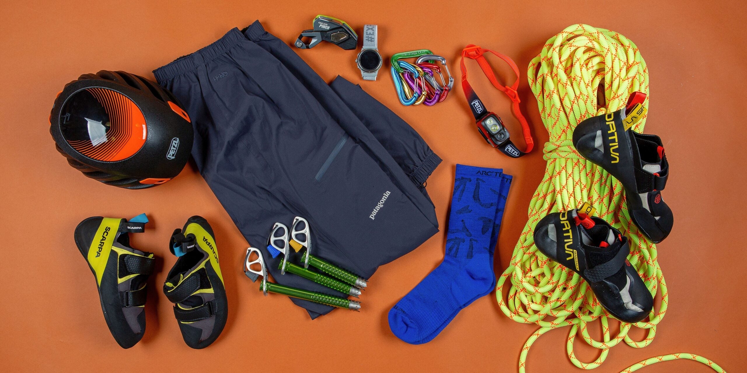 An assortment of climbing gear including ropes, shoes, and helmets, that represent the best climbing guide of 2024.