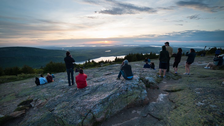 People watch the sun rise from Cadillac Mountain, Acadia National Park