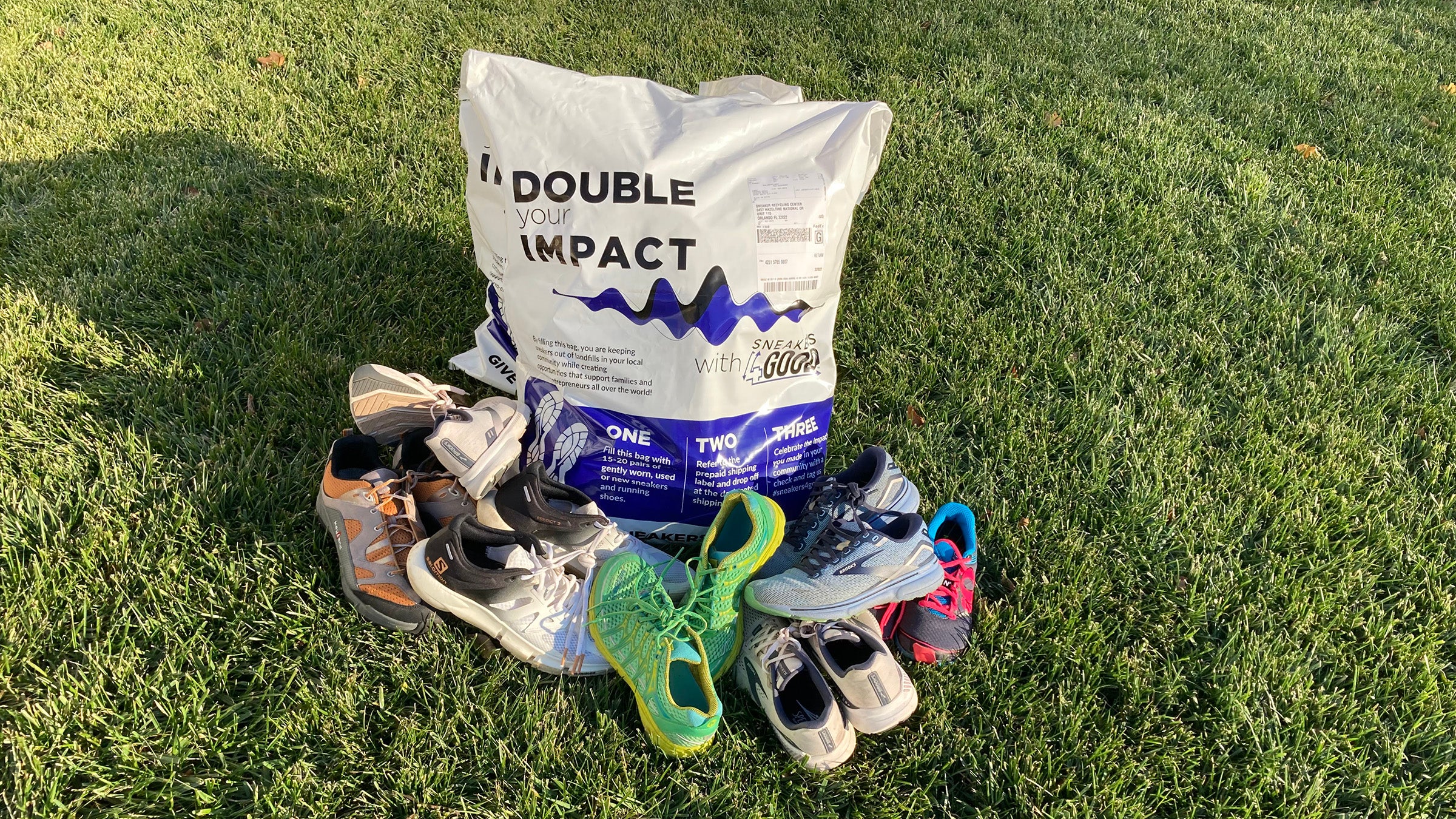 Pile of shoes with a donation bag