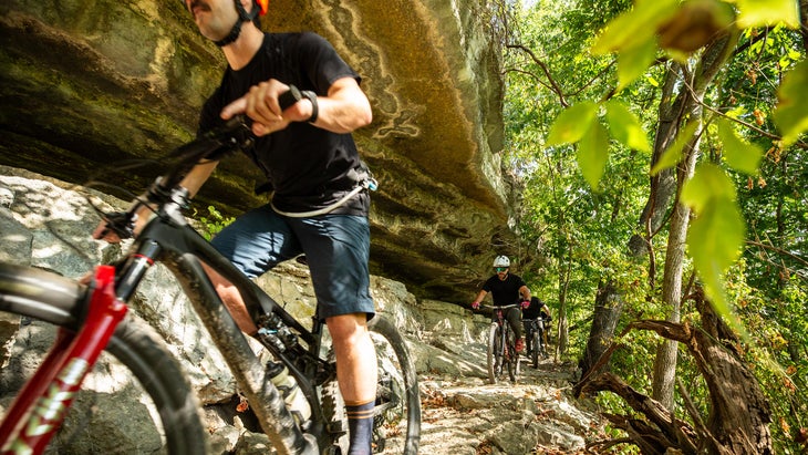 mountain biking by a cliff in Bella Vista, near Bentonville, Arkansas