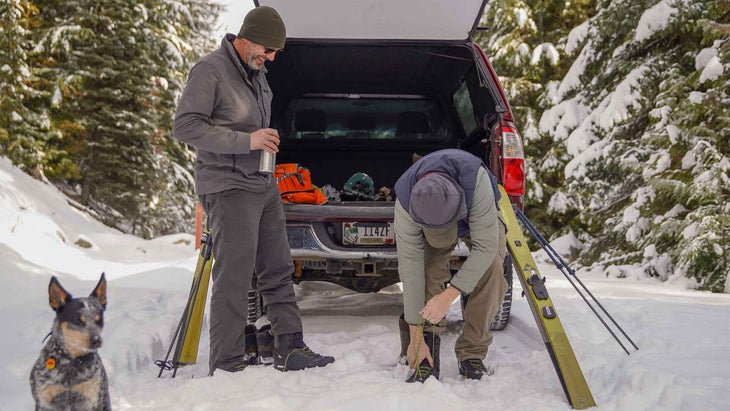 Two men get ready to cross-country ski