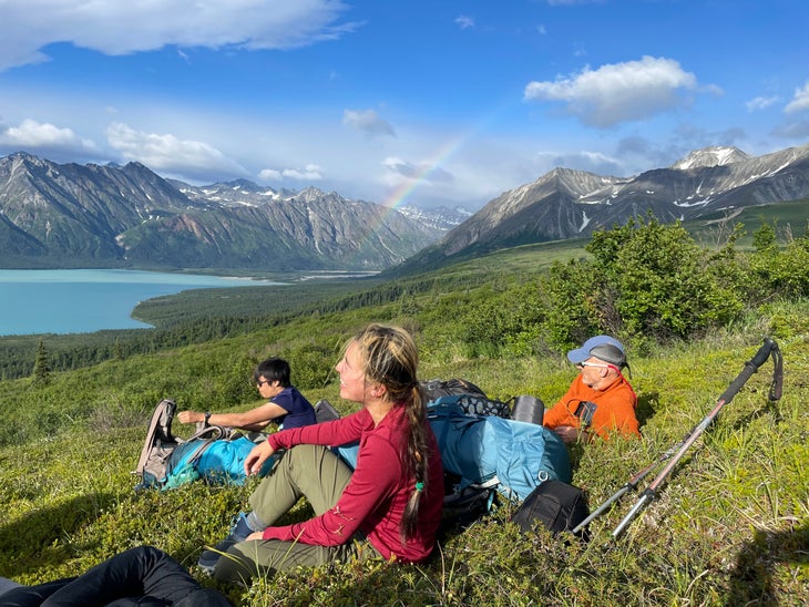 Three people above Turquoise Lake, Lake Clark