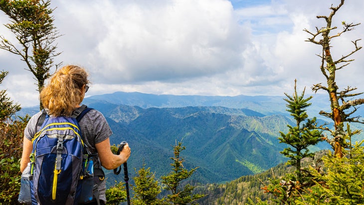 A woman hiker on summit of Mt. LeConte, Great Smoky Mountains National Park