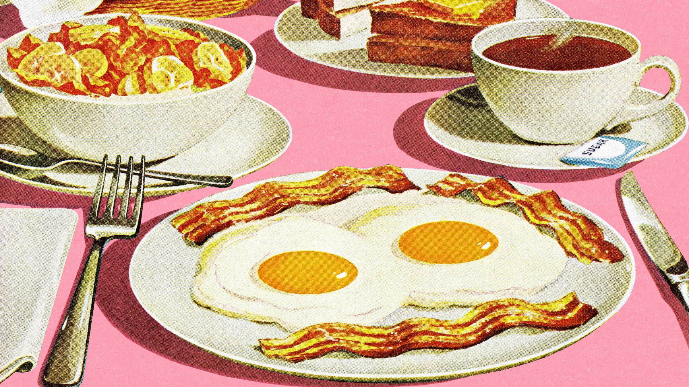 Full breakfast spread on pink background