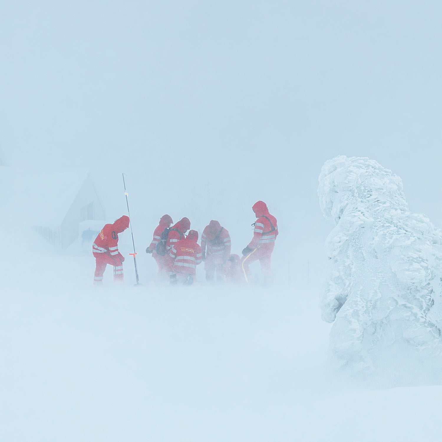 A group of rescuers aid a hypothermia victim.