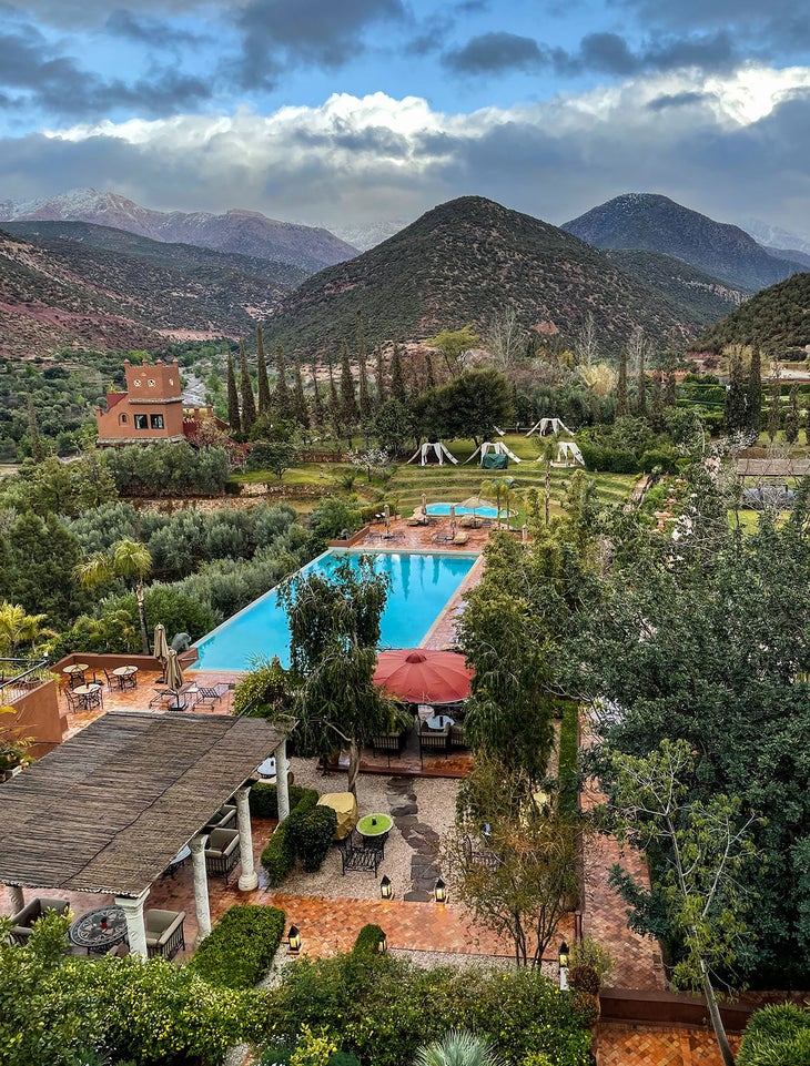 Kasbah Tamadot with the mountains in the background in Morocco