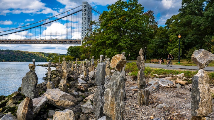 Empire State Trail, New York, passes George Washington Bridge over the Hudson River