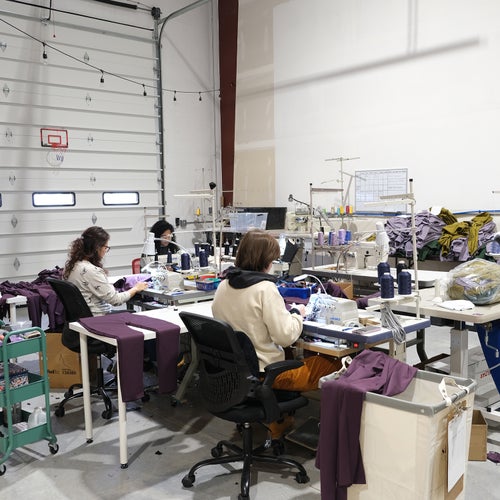 Factory workers sewing