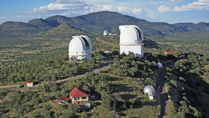 An aerial view of the McDonald Observatory in Texas, with several huge telescope domes