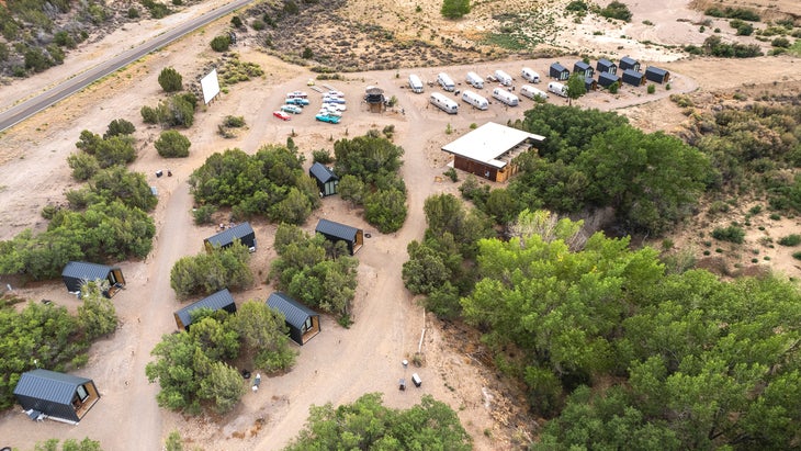 cabins, movie screen, Airstreams, and lodge at Ofland Escalante, a stop on one of the best road trips in the southwest