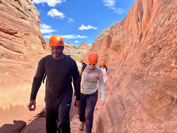 DeMarco Williams and Meredith Holser in a canyon in Utah