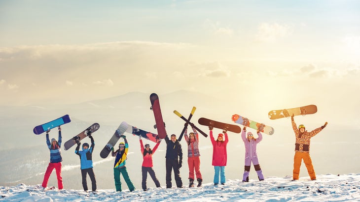 exuberant women at ski and snowboard retreat