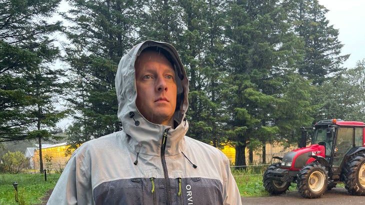 travel writer Ryan Krogh enjoying the weather at Iceland's Friðheimar tomato farm and wondering where he should go on vacation in 2025