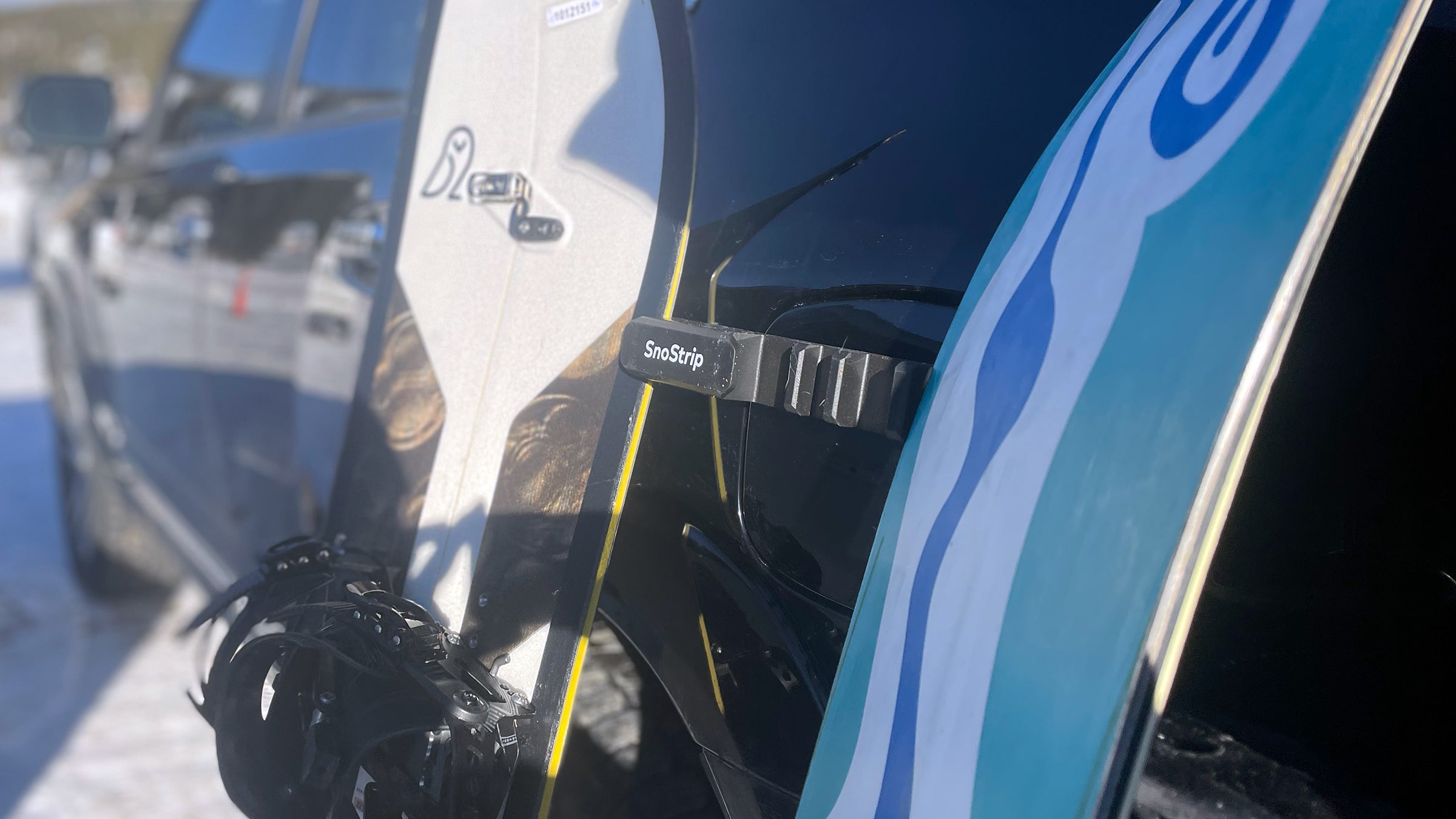 SnoStrip holding snowboards on ski trip