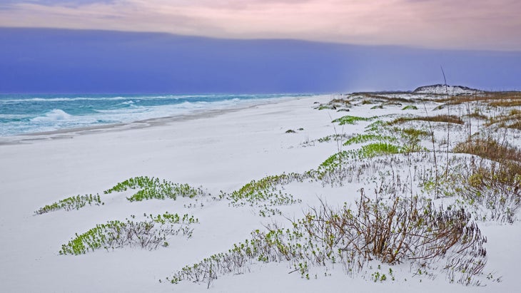 white sand dunes and sunset sky at Gulf Islands National Seashore, Florida