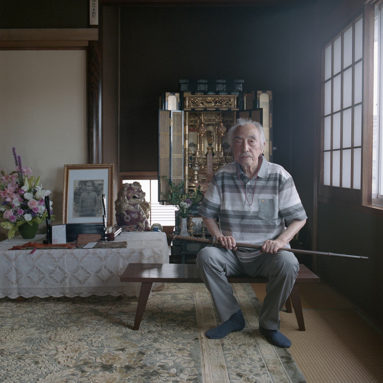 Umeki with the sword in front of his father's altar in Nichinan