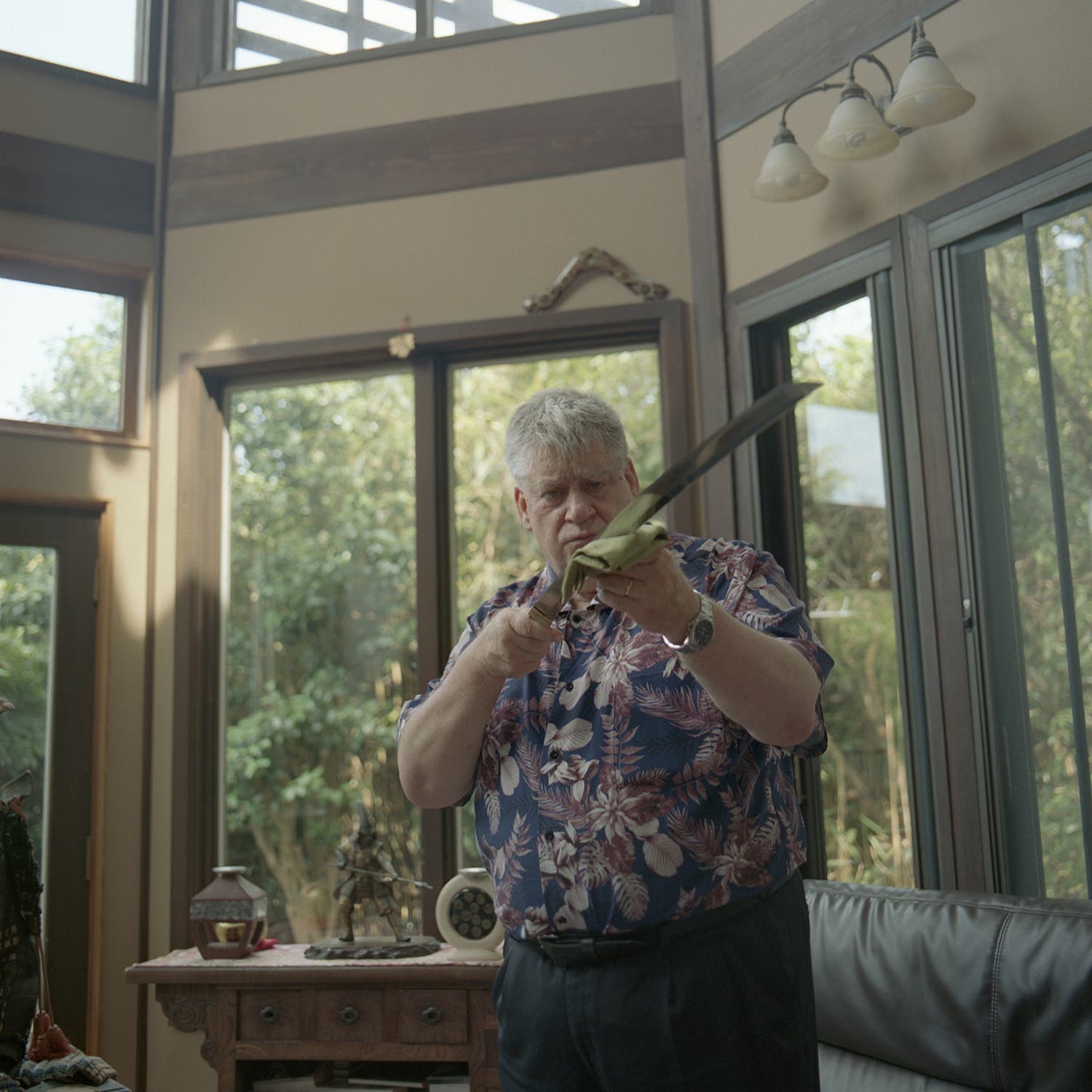 Hughes cleaning a sword at his home in Kamakura