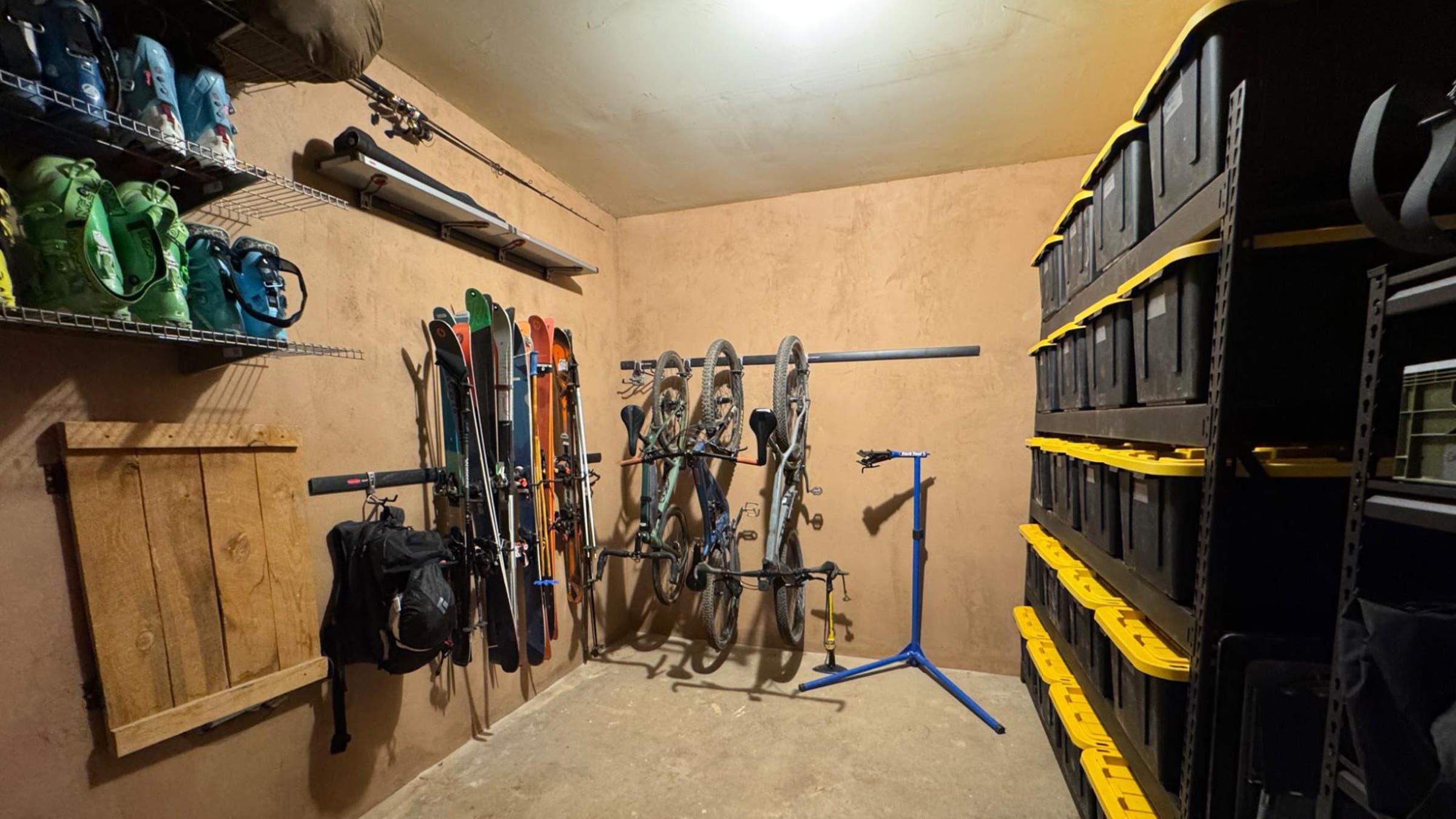 Outdoor gear and sports equipment stored neatly in a garage
