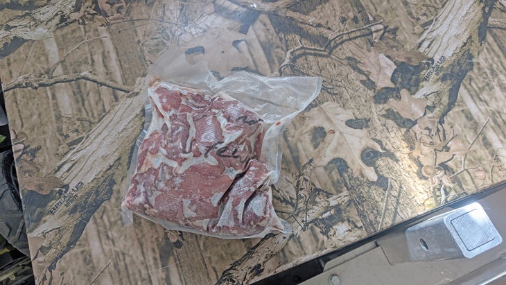 Frozen game meat in a bag.