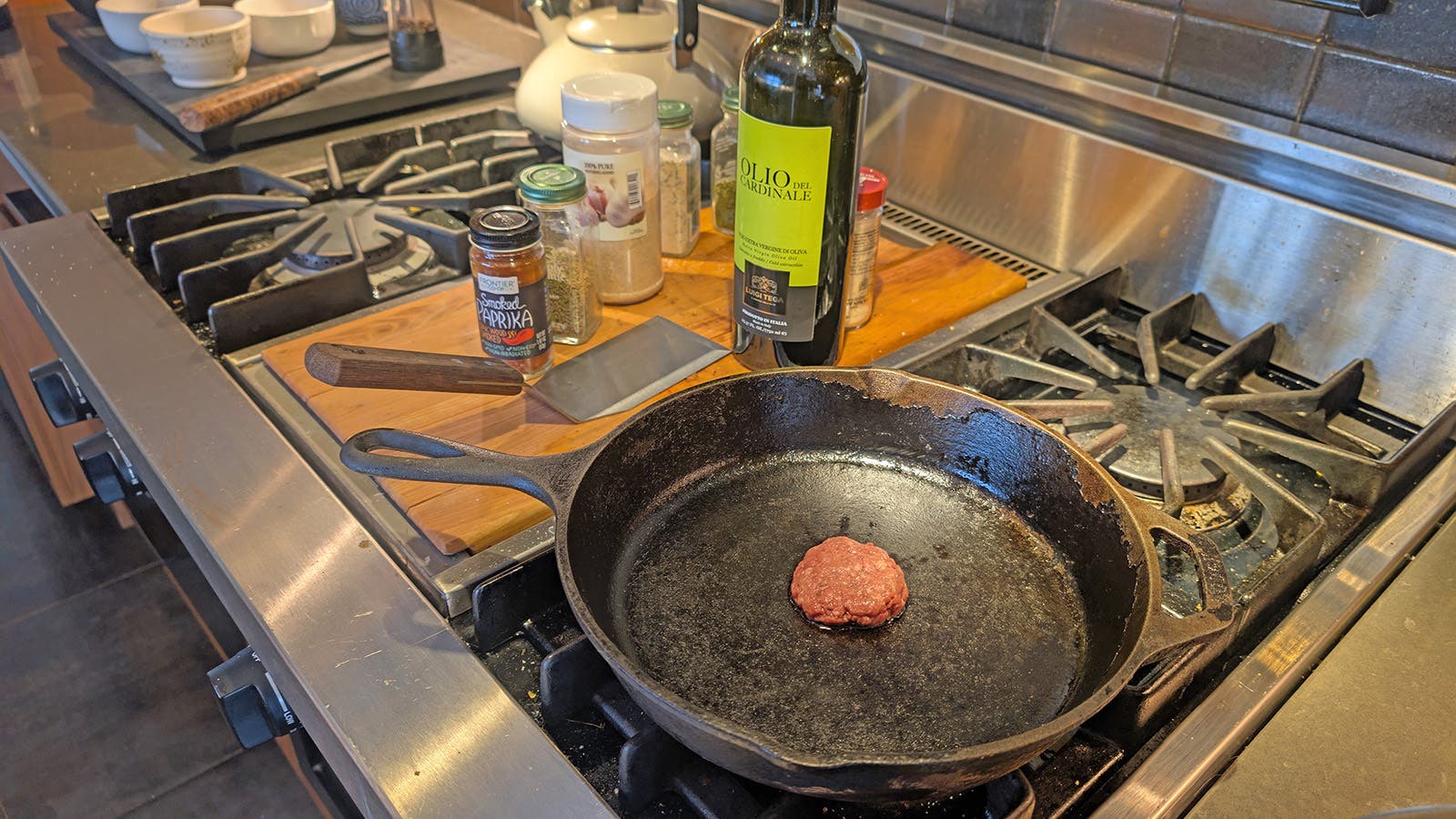 A sausage patty frying