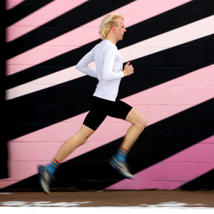 blond runner in colorful city