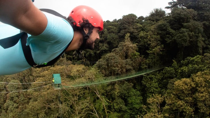 Selfie of man extreme-zip-lining in Costa Rica