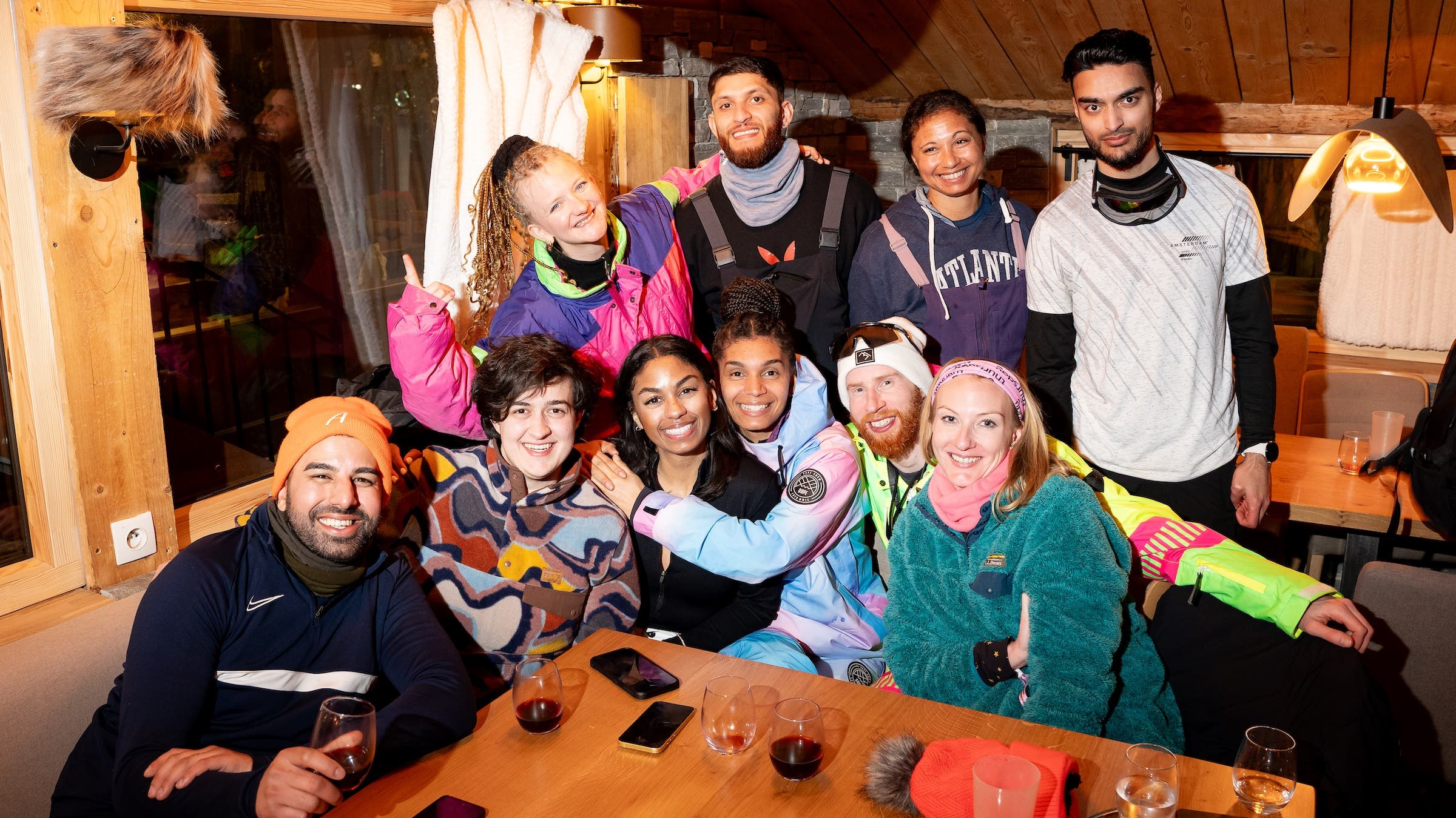 group of people posing at dinner table