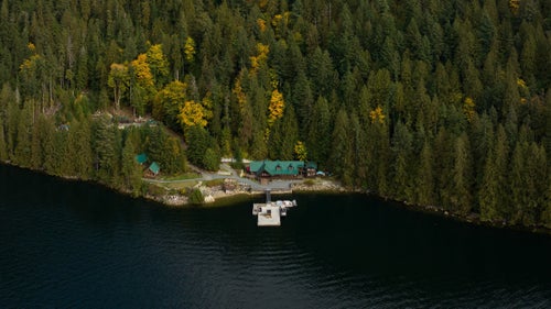 overhead shot of cabin on lake