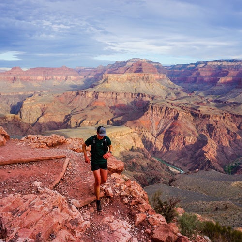 man running on red rock