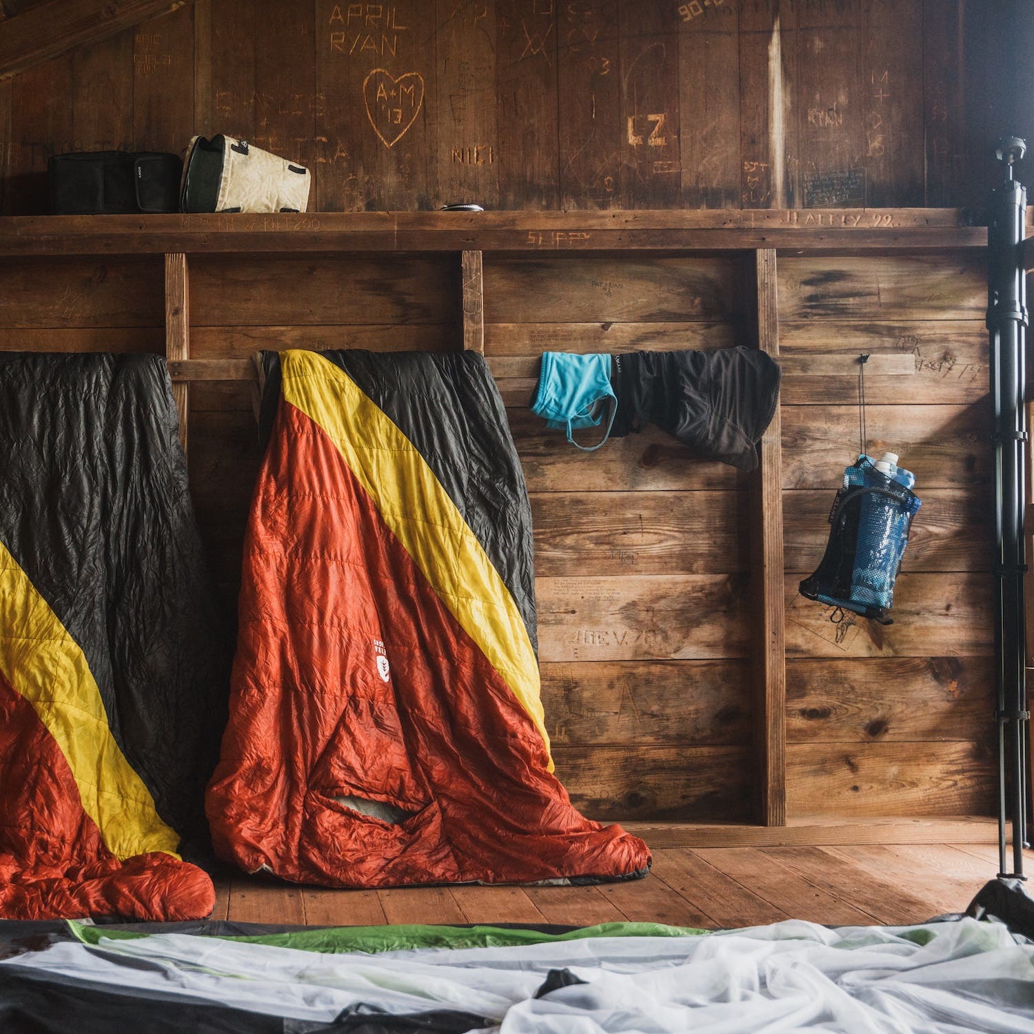 colorful sleeping bags in shelter