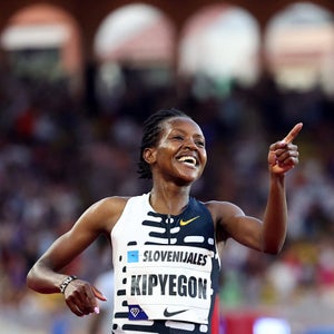 Faith Kipyegon of Kenya celebrates after breaking the World Record and winning in the Women's One Mile event during the IAAF Diamond League
