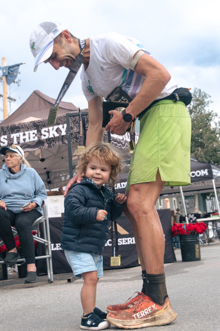 David Roche stands with his son Ollie at the Leadville 100 finish line.