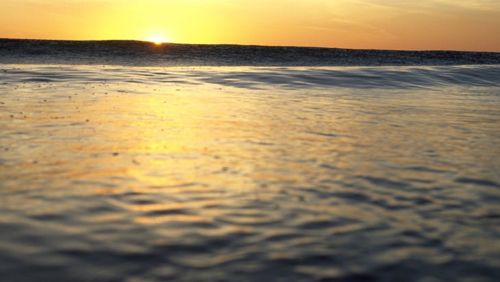 Wave greets the sunshine at Avellanas beach, Nicoya Peninsula, Costa Rica.