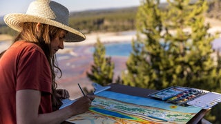 Woman painting at Yellowstone National Park