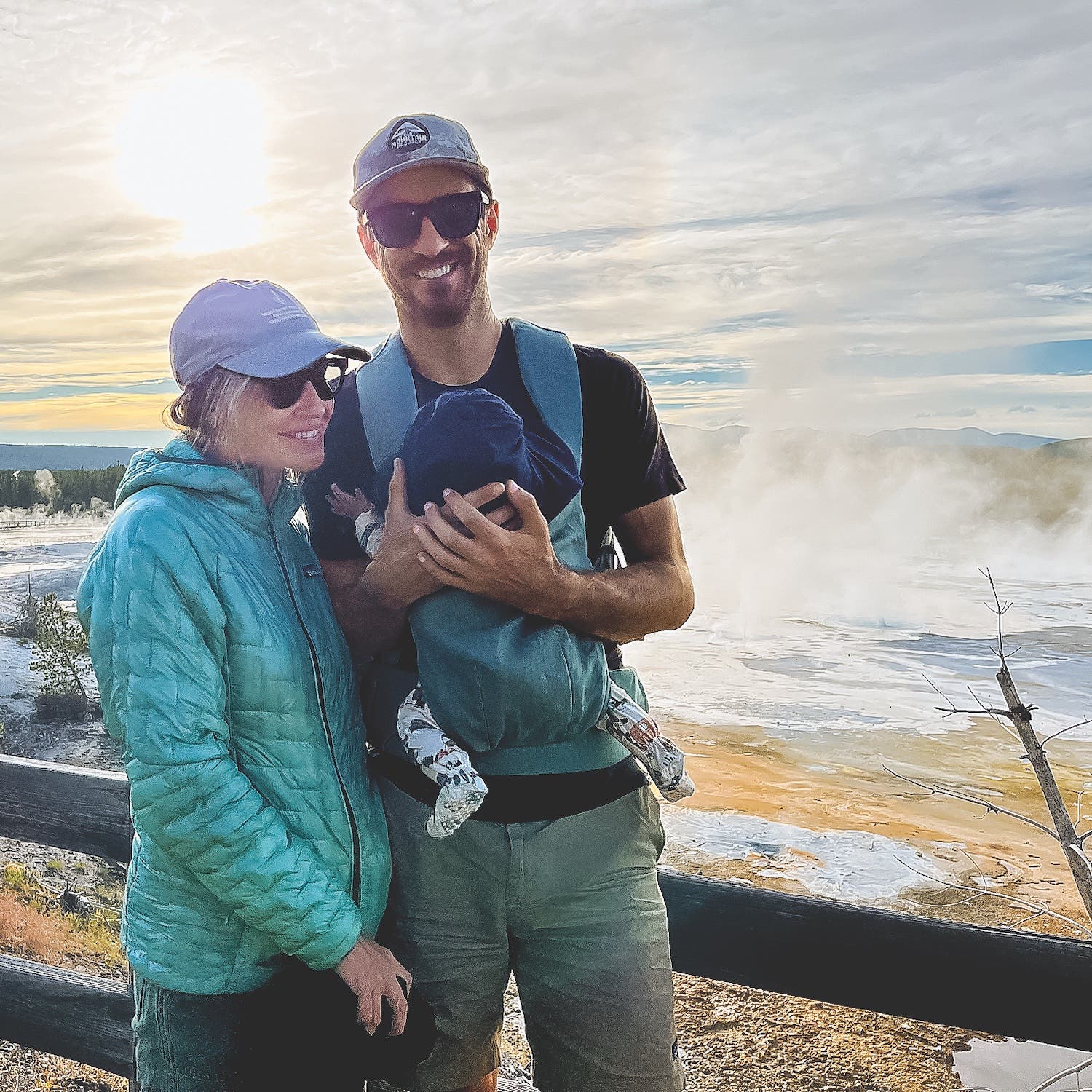 couple posing with baby
