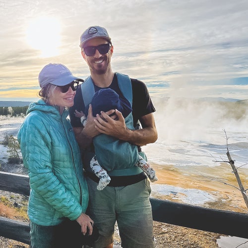 couple posing with baby