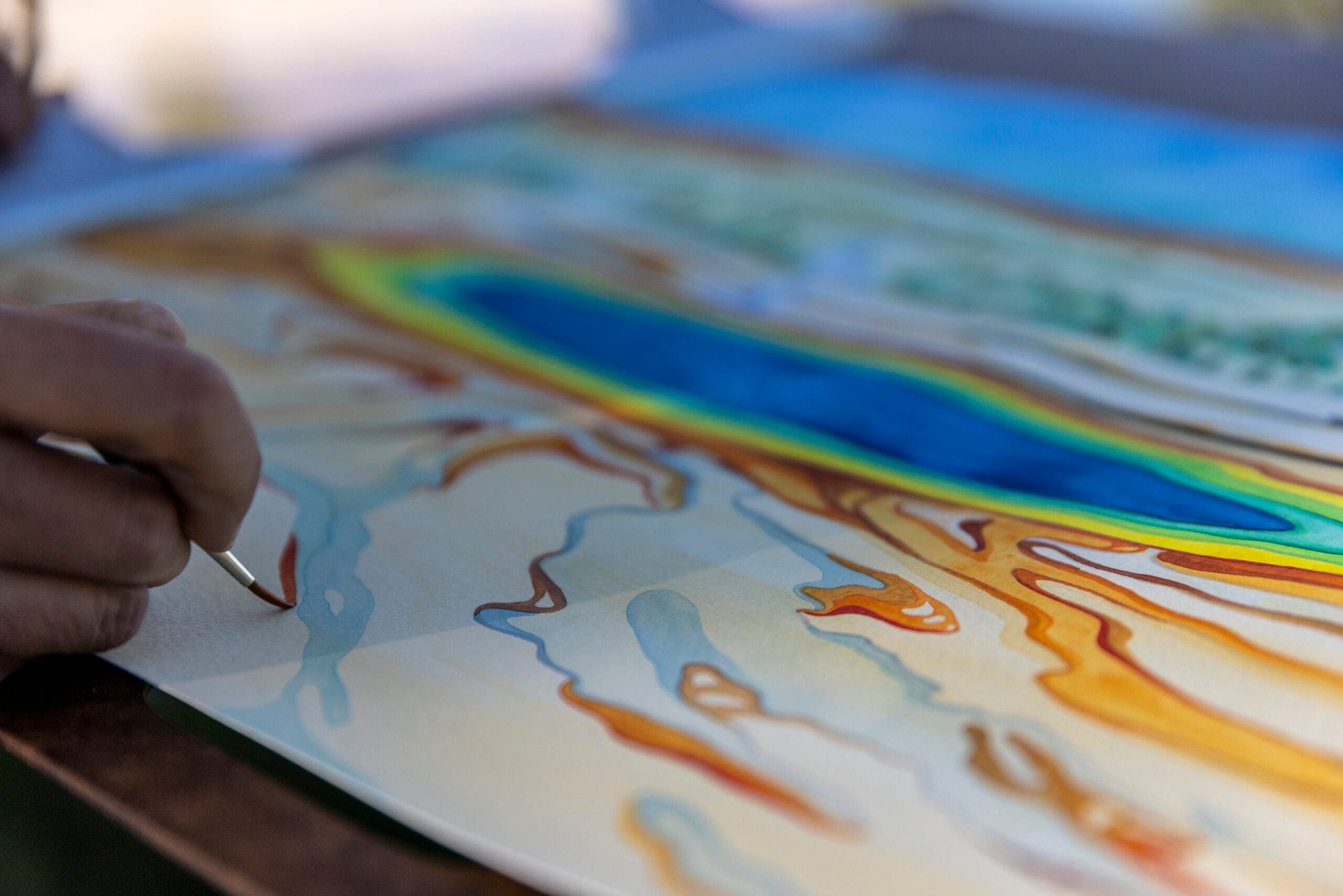 Bryn Merrell paints Grand Prismatic Spring in Yellowstone National Park.