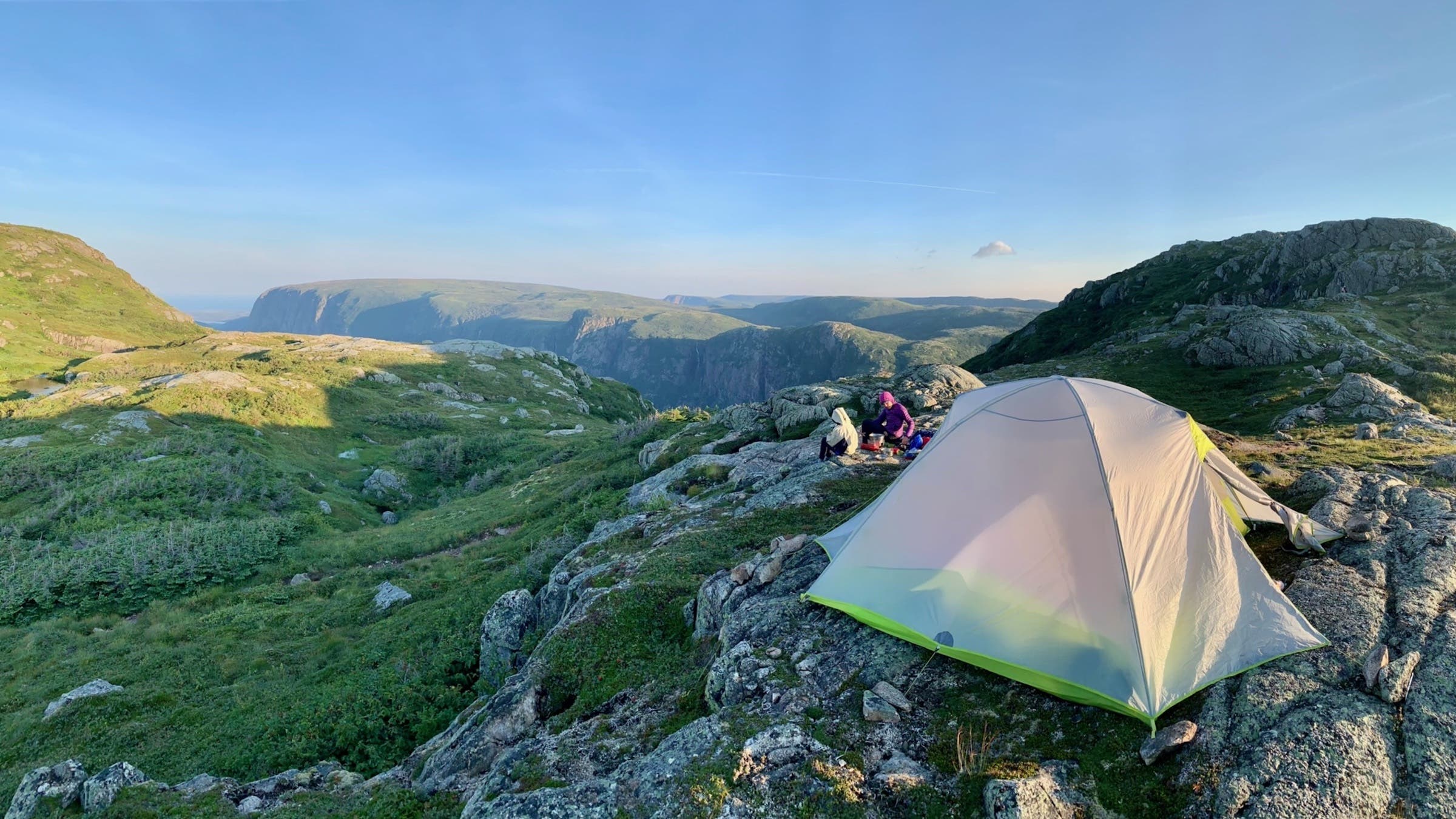 tent on rocky space with people in background